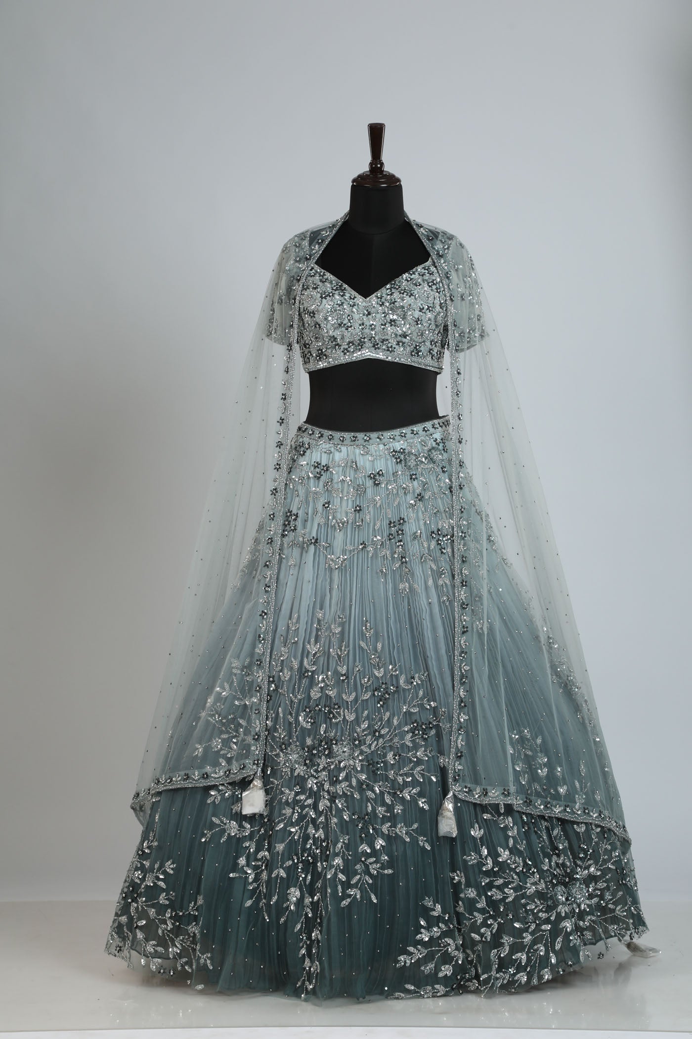 Shaded handcrafted lehenga on net.