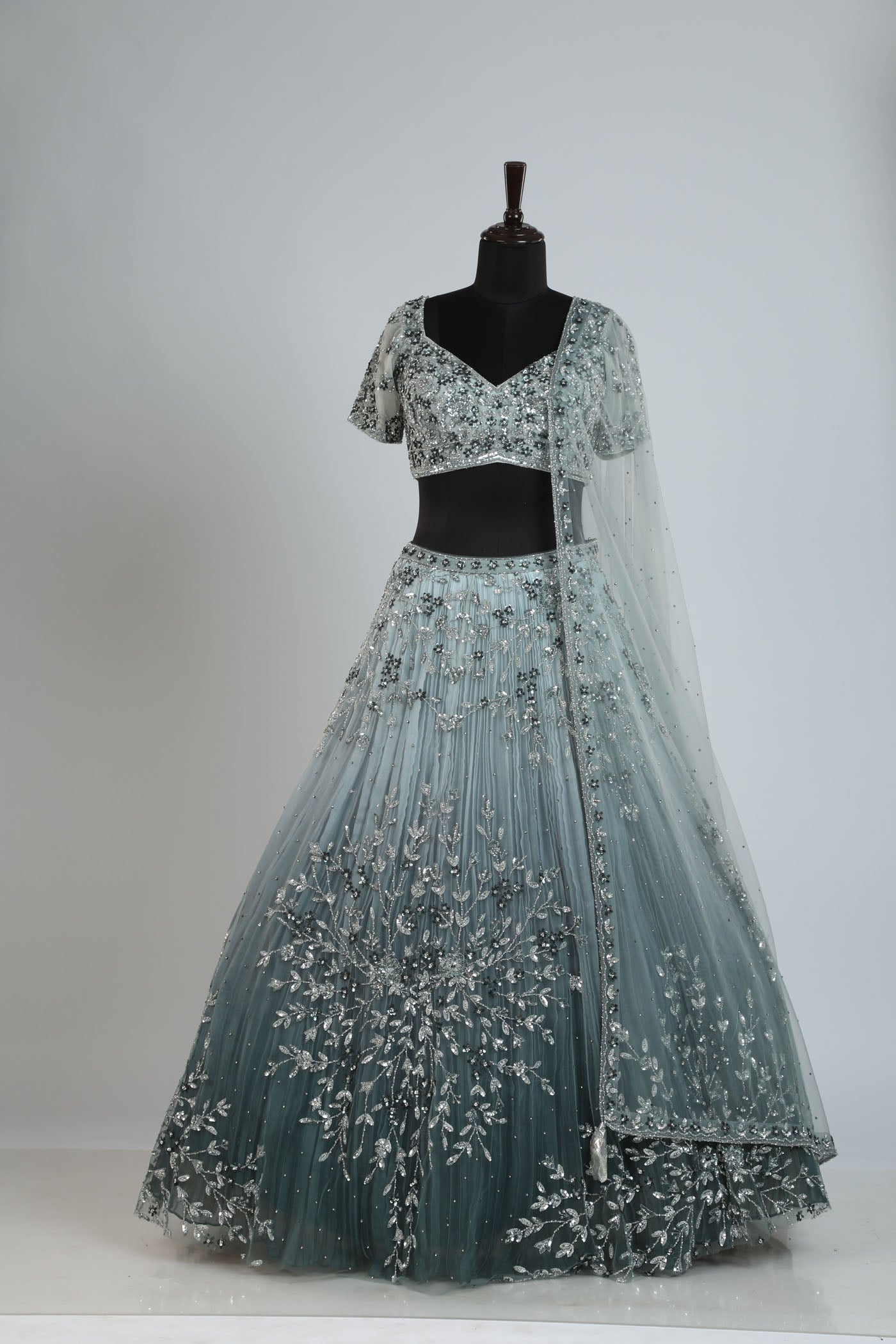 Shaded handcrafted lehenga on net.