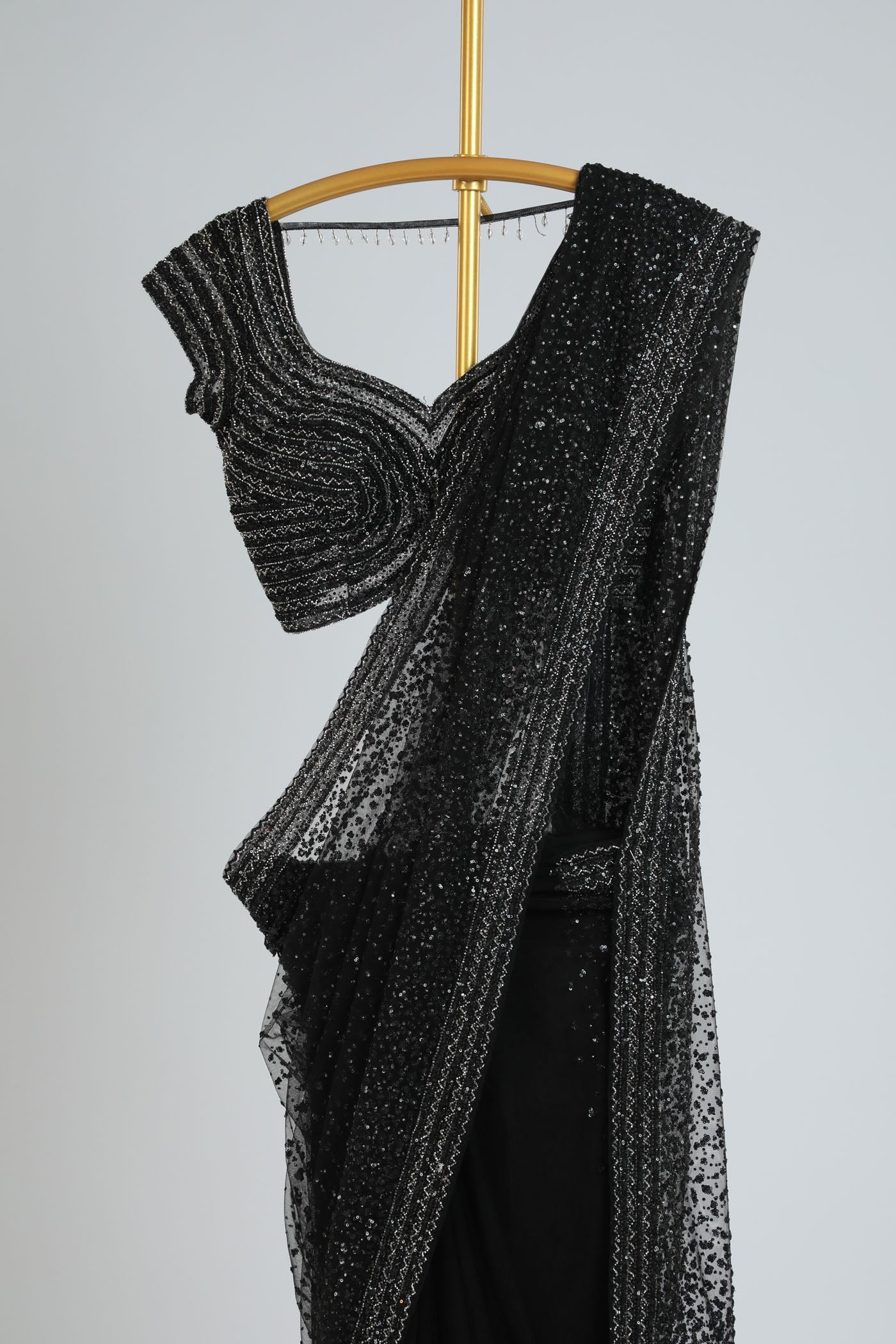 Embroidered net saree with ready made blouse.