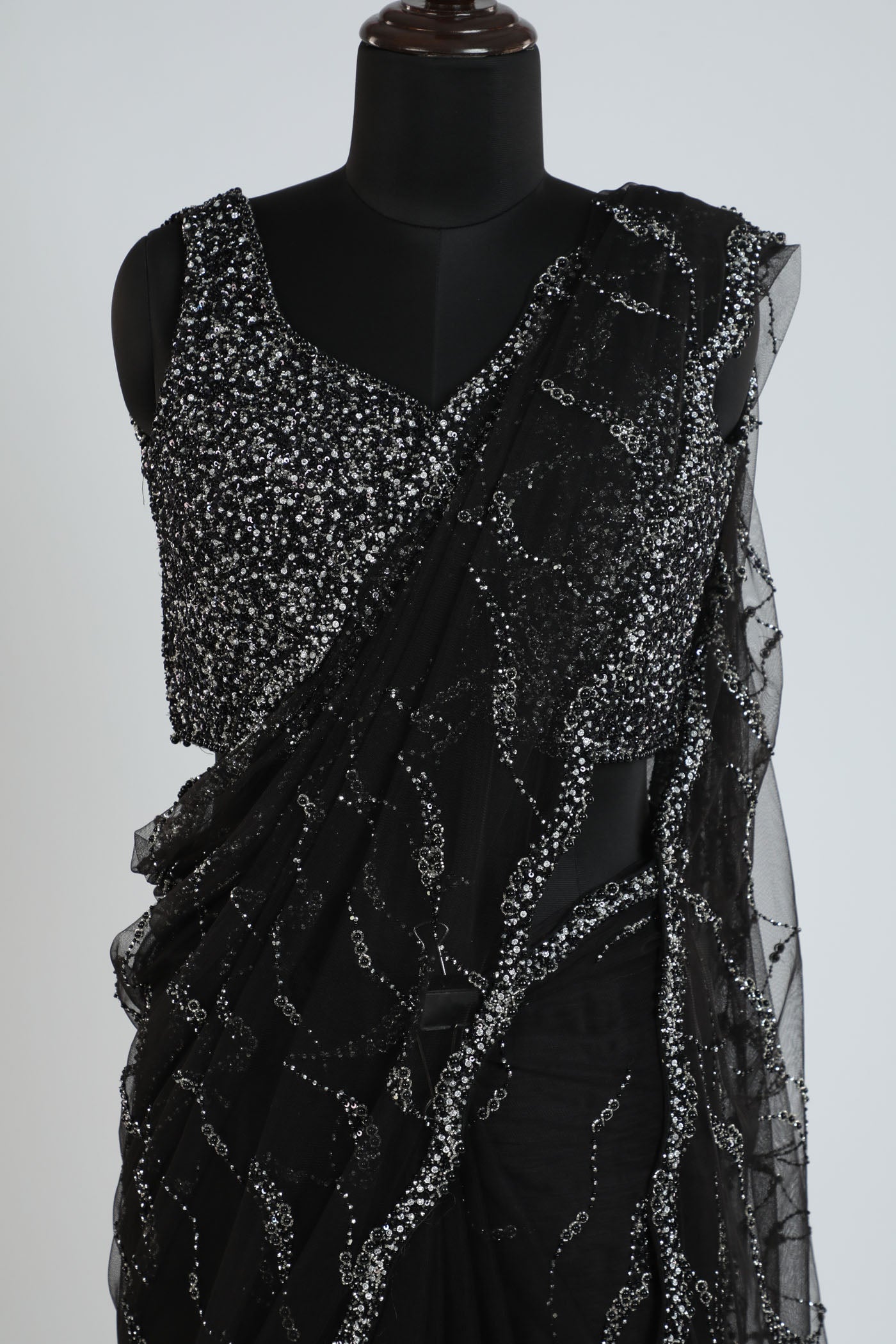 Embroidered net saree with readymade blouse.