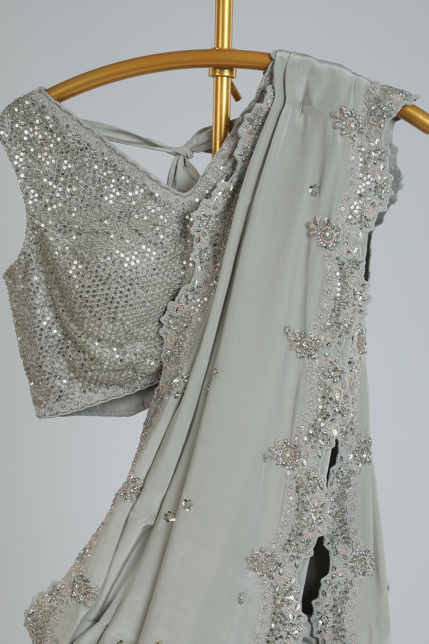 Embroidered saree with a readymade blouse.