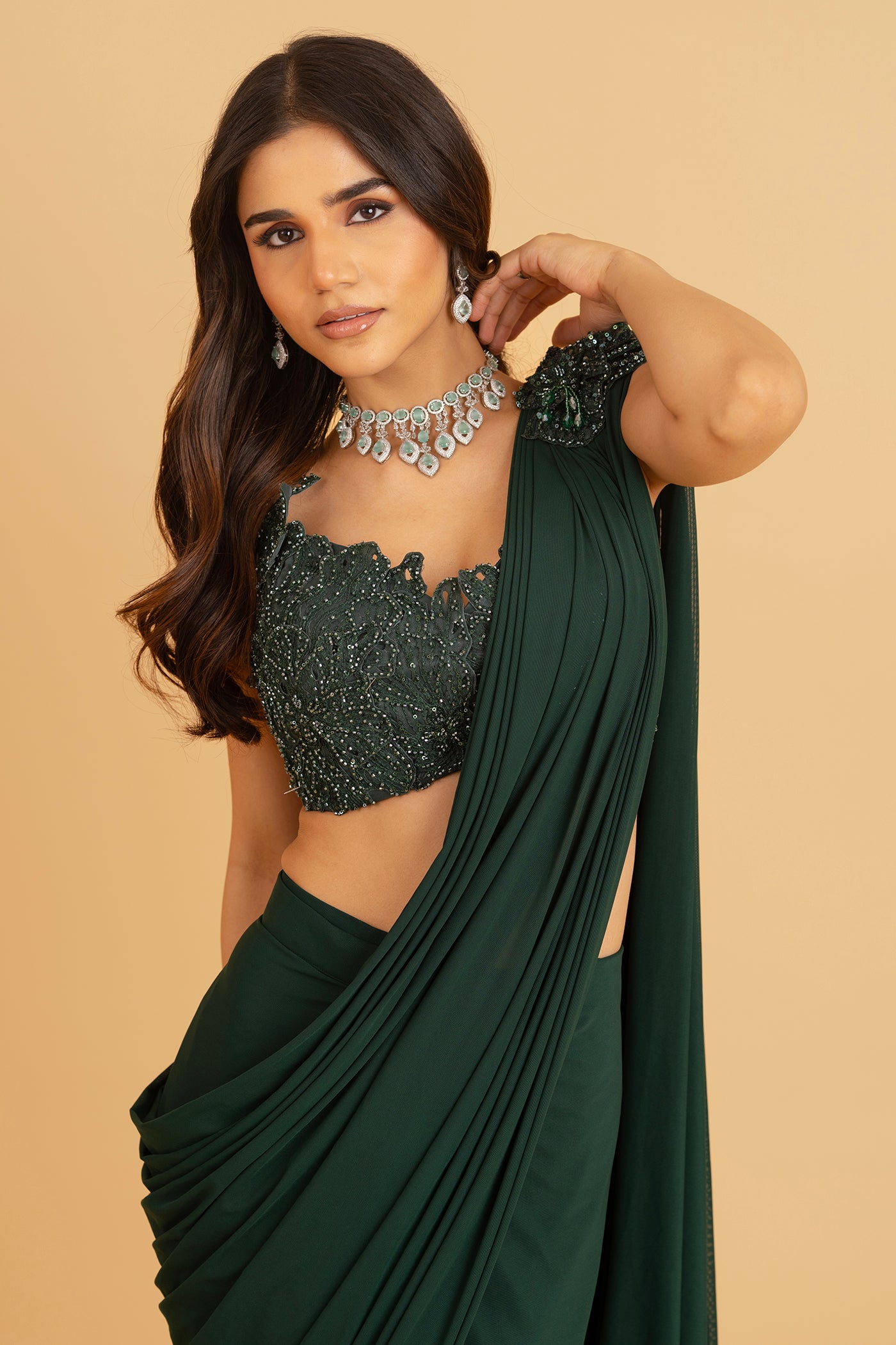Emerald green ore draped saree with stitched blouse