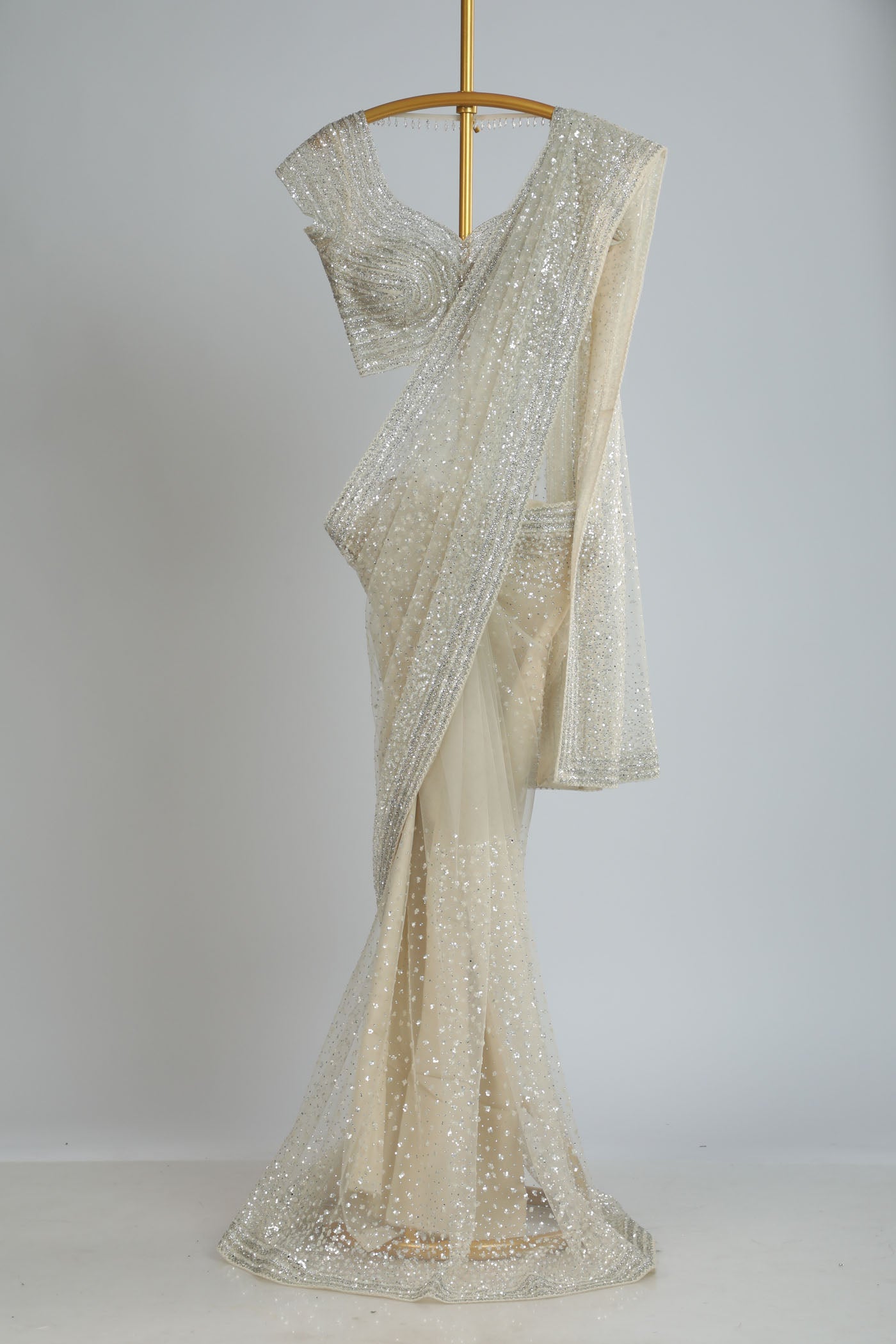 Embroidered net saree with ready made blouse.