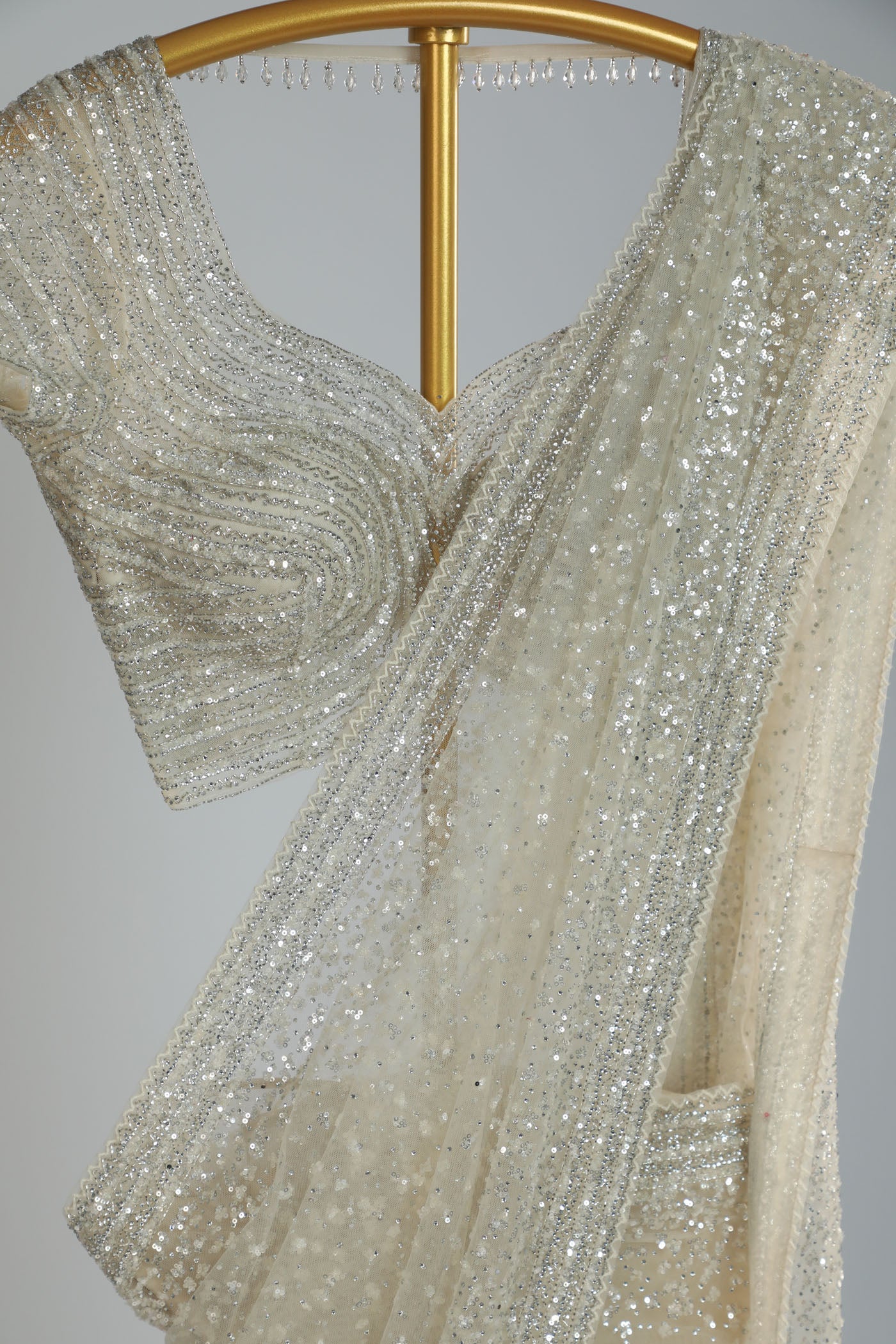 Embroidered net saree with ready made blouse.