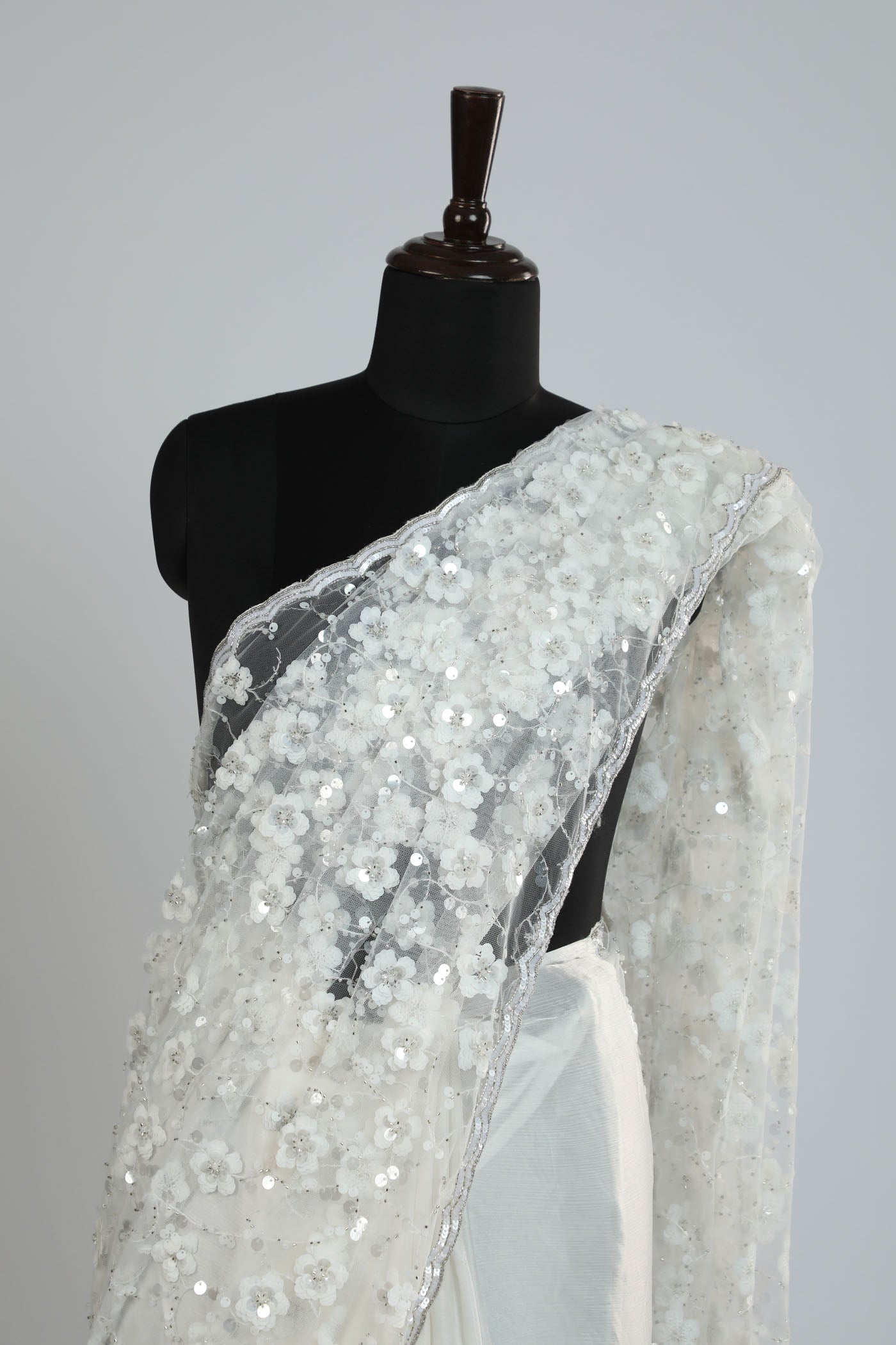 Pearl white hand Crafted Embroidery saree.