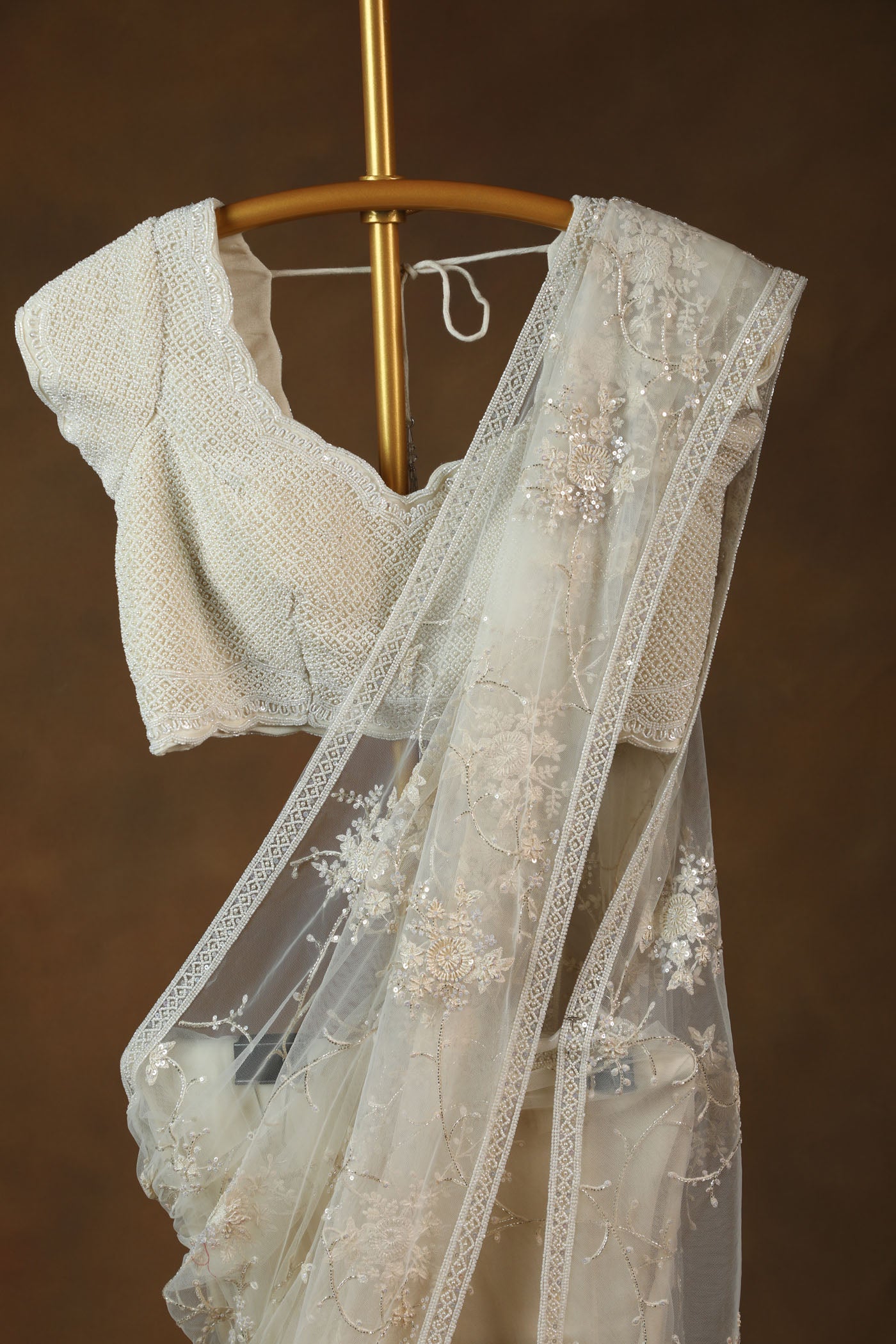 Ivory Embroidered Net Saree with Textured pearl Blouse (RTS)