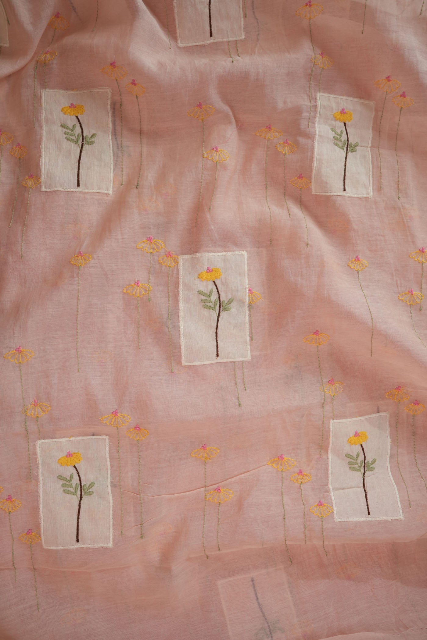 Soft Pastel Pink Fabric with Hand-Embroidered Floral Motifs