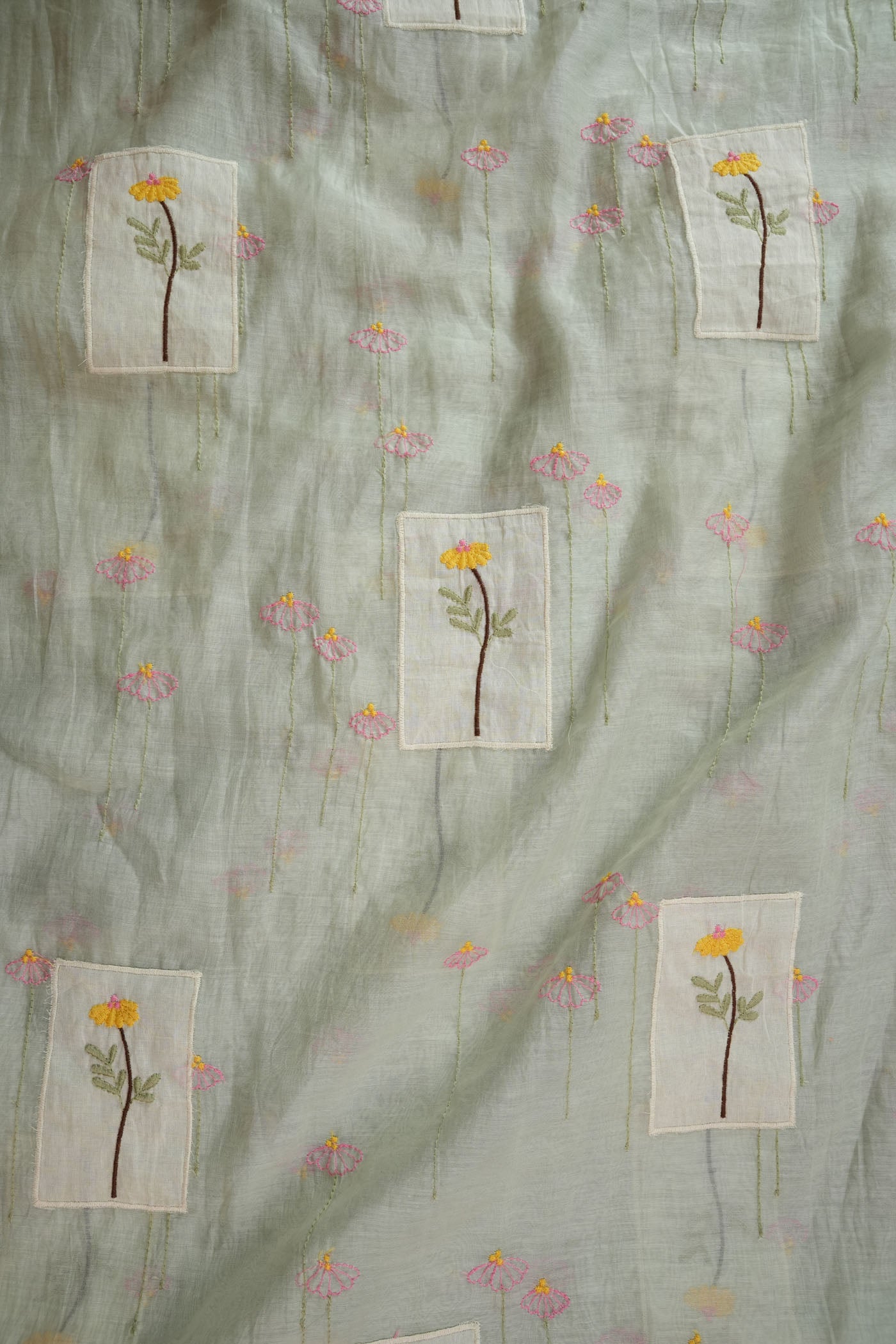 Soft Pastel Green Fabric with Hand-Embroidered Floral Motifs