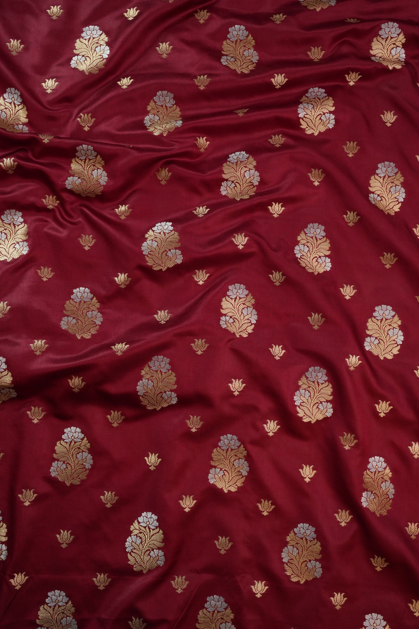 Maroon Fabric with Golden Zari Floral Buta