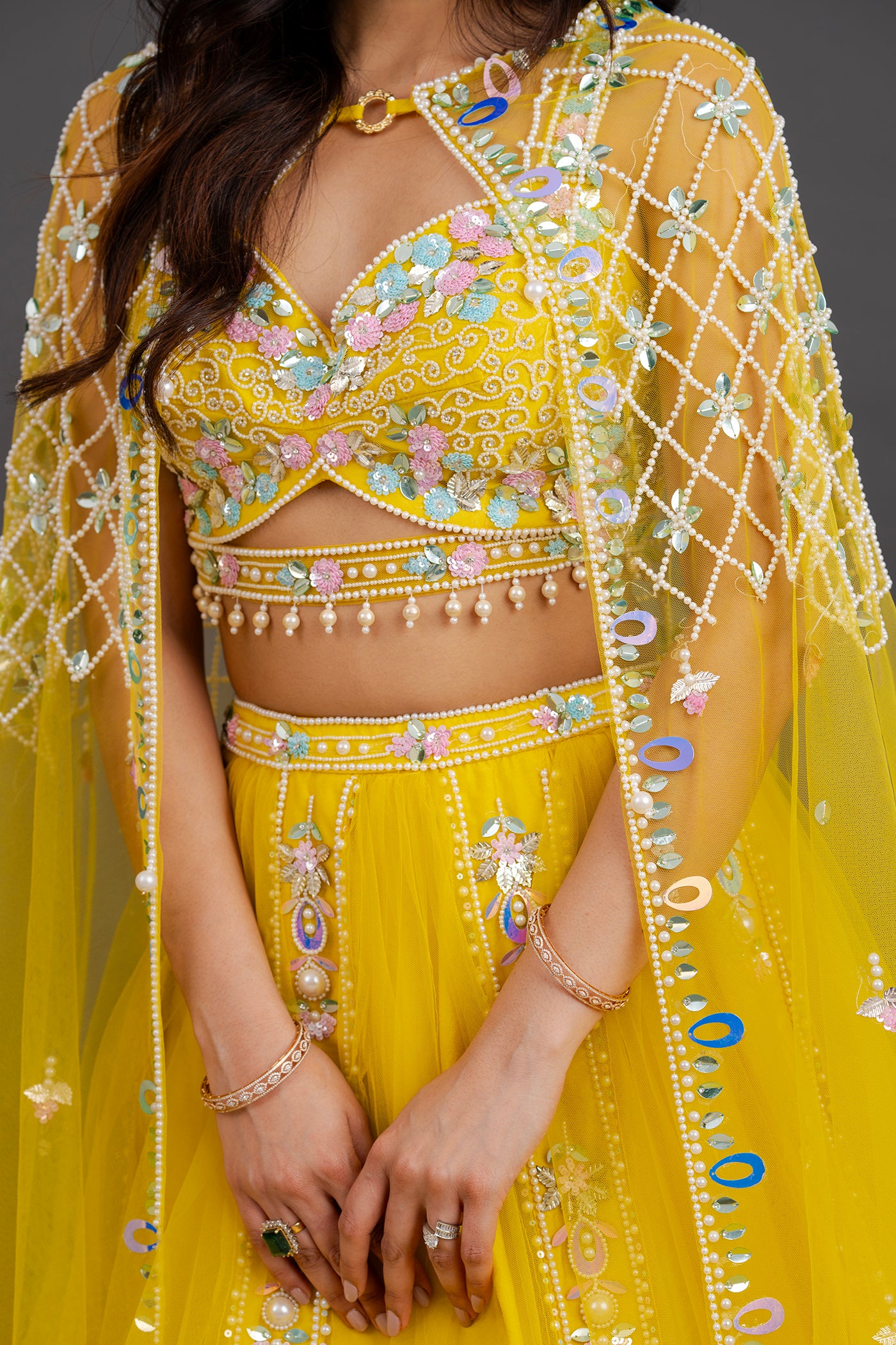 Vibrant yellow net lehenga with floor length cape (RTS)