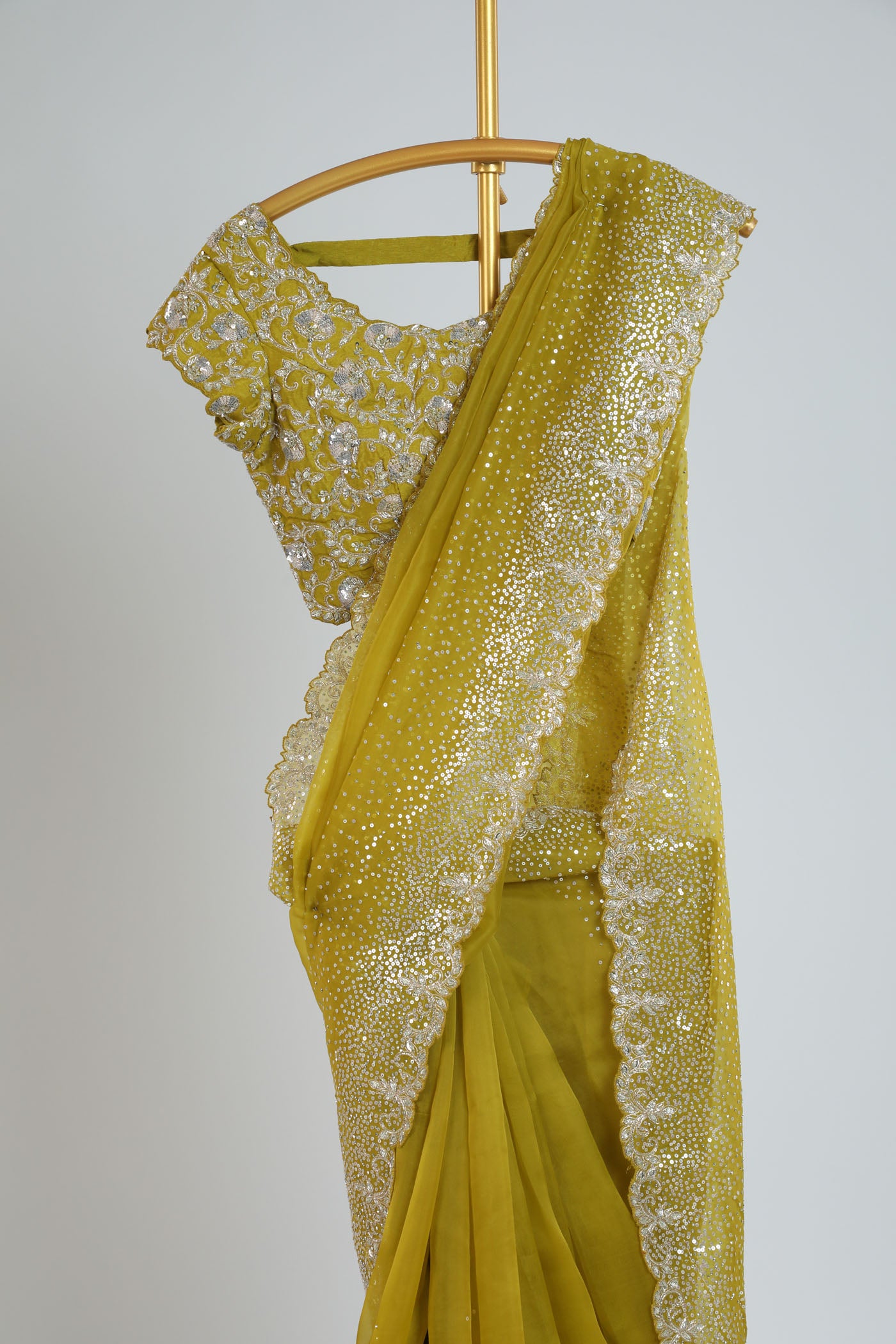 Organza saree with readymade blouse.