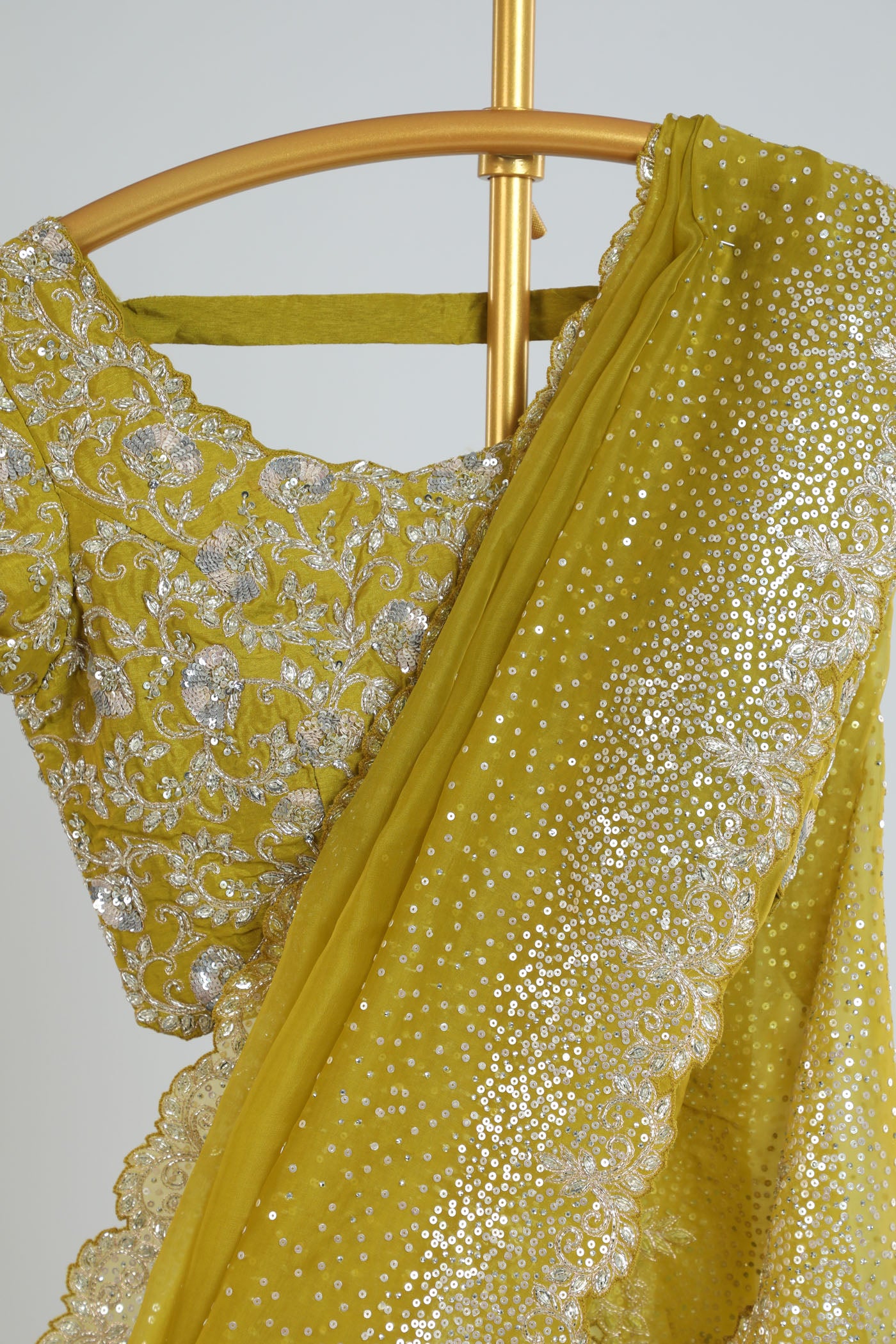 Organza saree with readymade blouse.