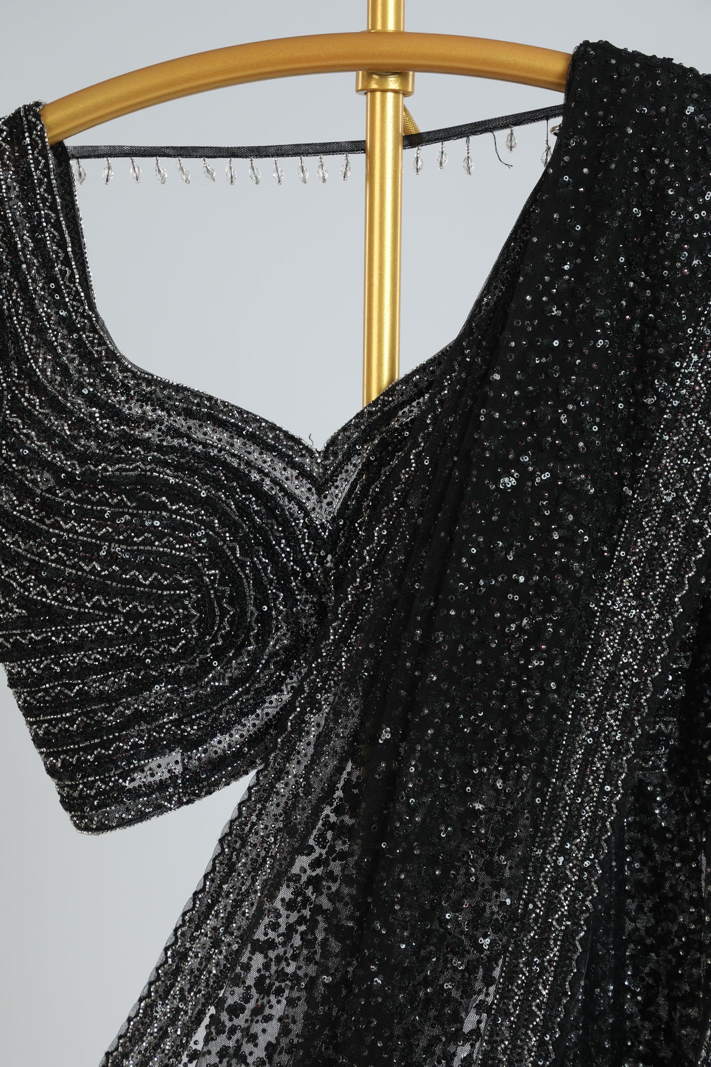 Embroidered net saree with ready made blouse.
