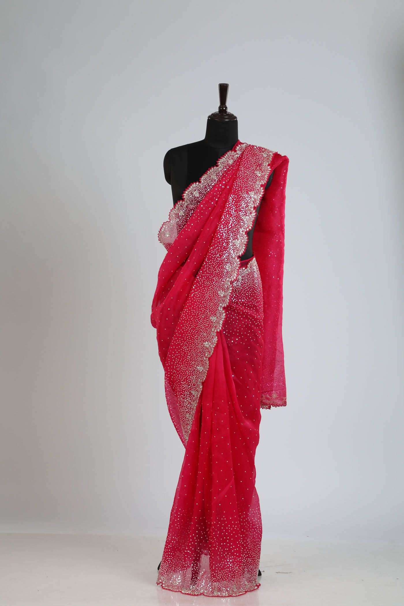 Organza saree with readymade blouse.