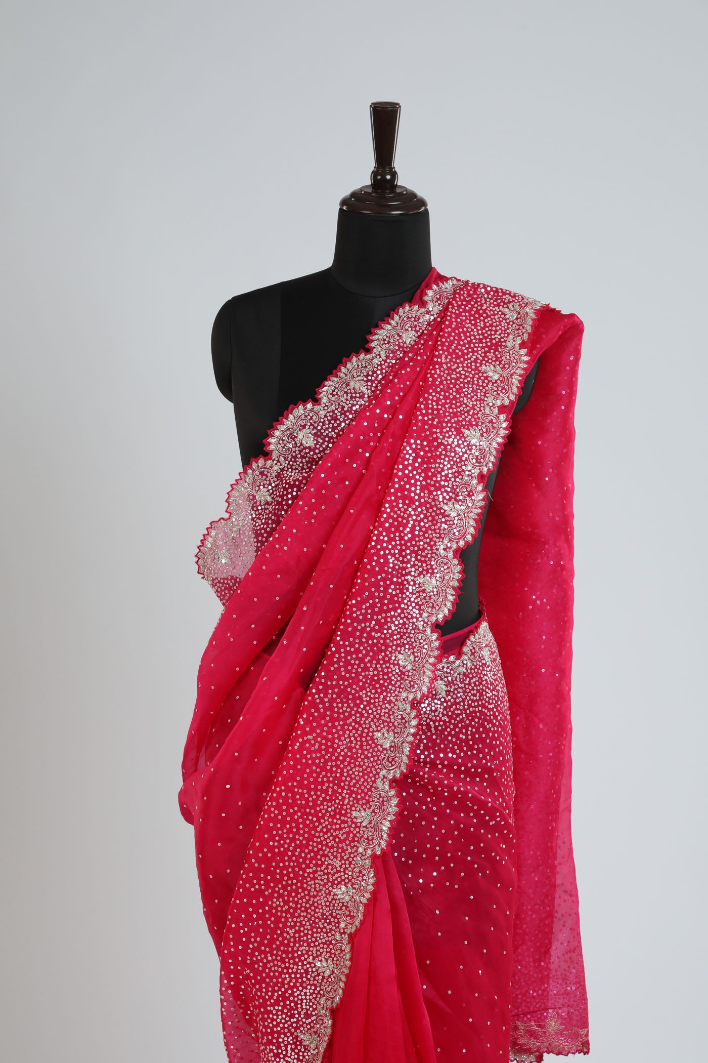 Organza saree with readymade blouse.