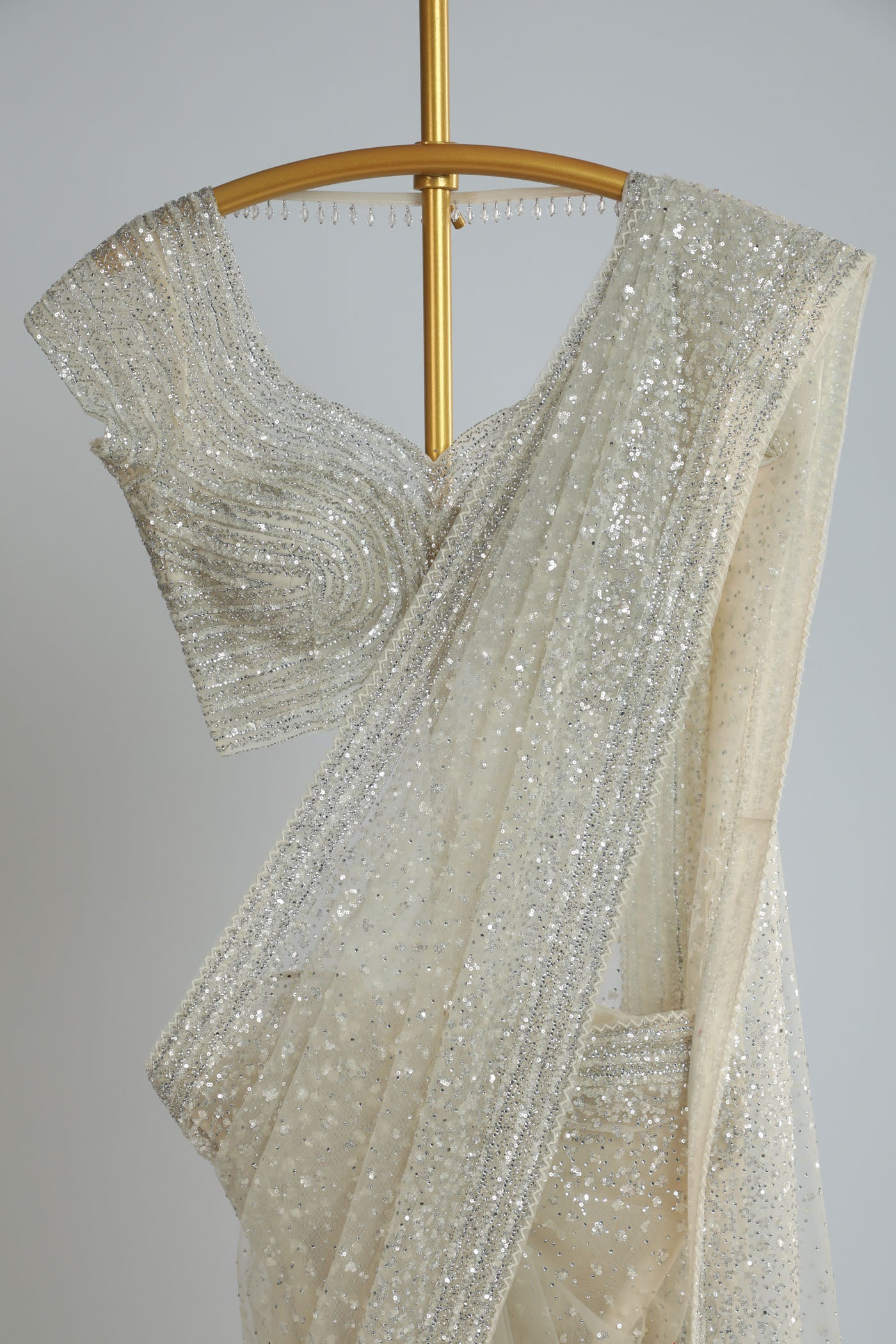 Embroidered net saree with ready made blouse.