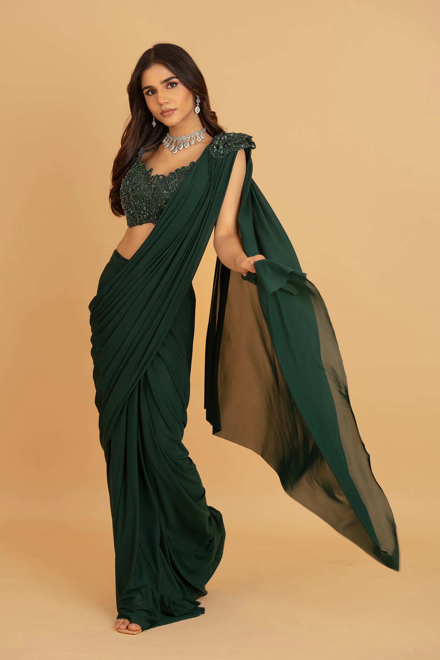 Emerald green ore draped saree with stitched blouse