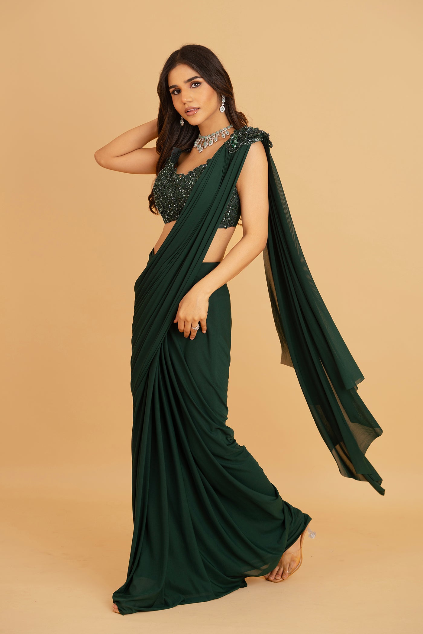 Emerald green ore draped saree with stitched blouse