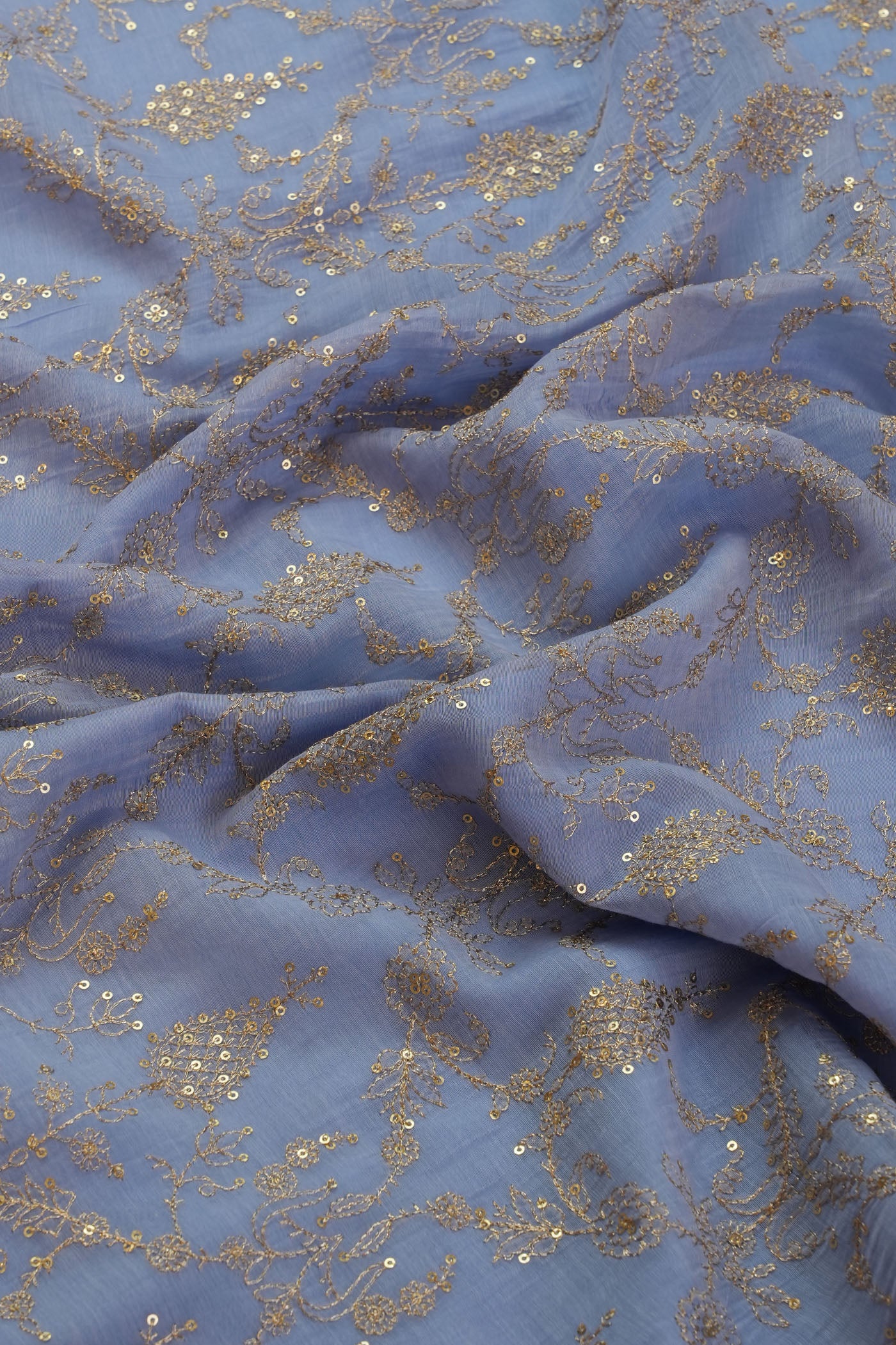 Elegant Blue Embroidered Fabric with Gold Accents.