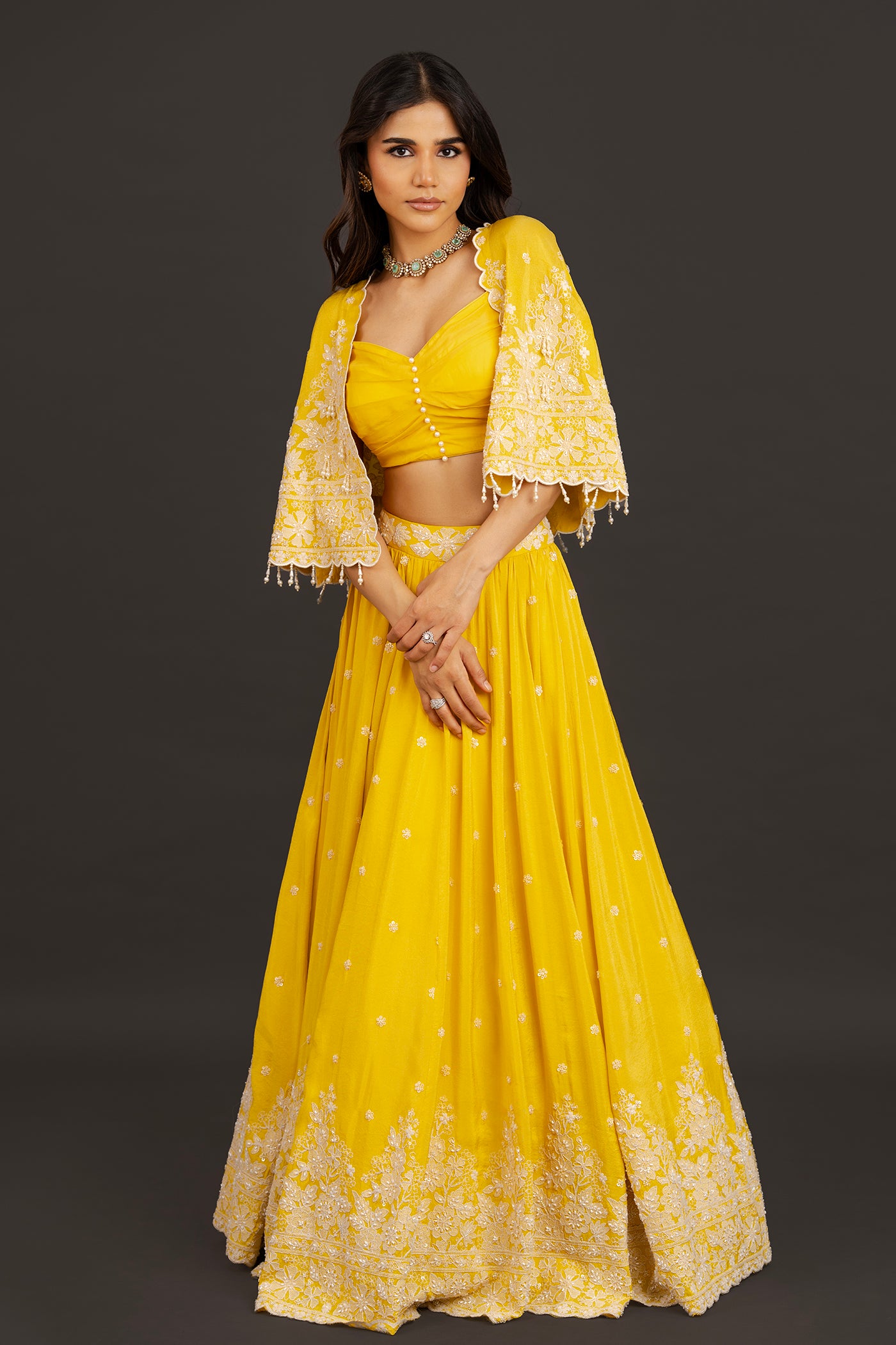Vibrant yellow lehanga with cape