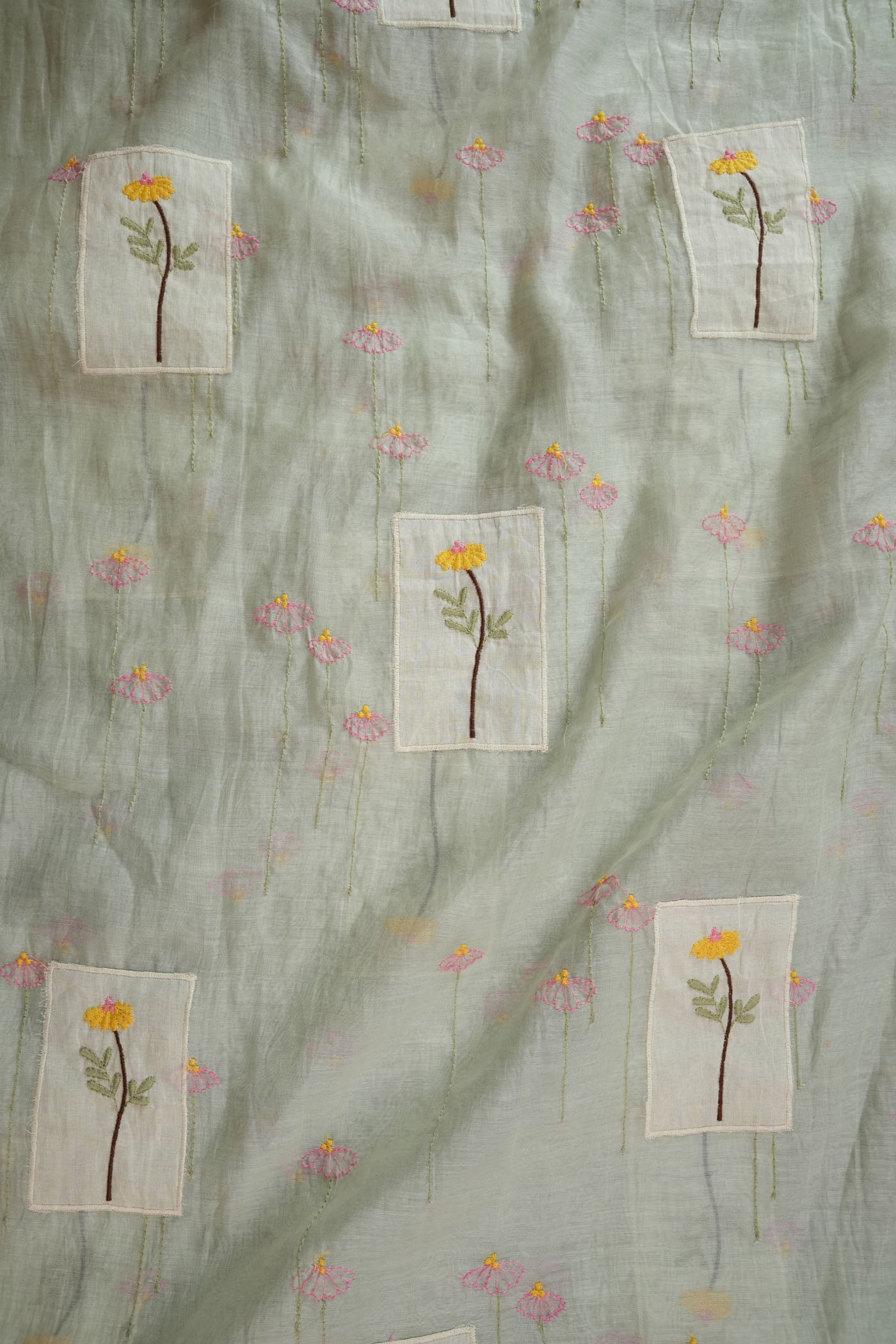 Soft Pastel Green Fabric with Hand-Embroidered Floral Motifs