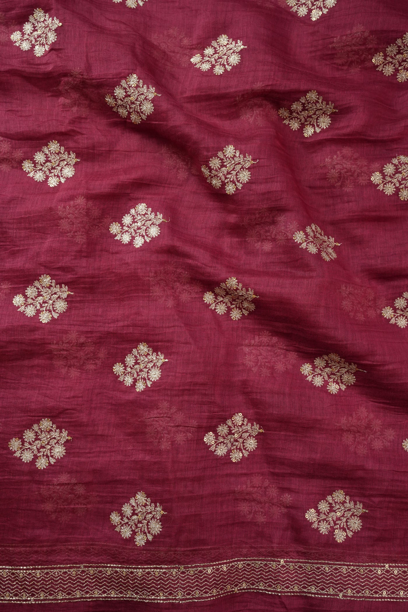 Maroon Fabric with Golden Zari Buta and Border Detailing