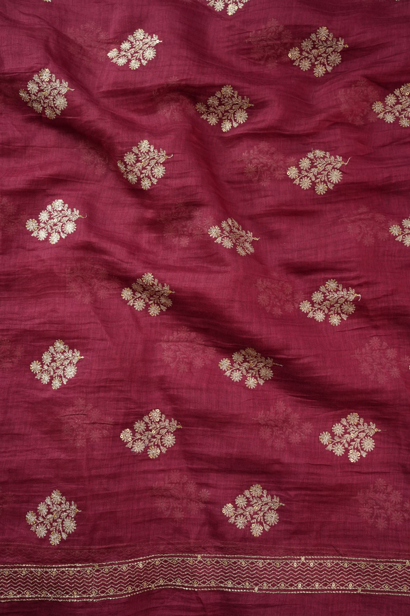 Maroon Fabric with Golden Zari Buta and Border Detailing