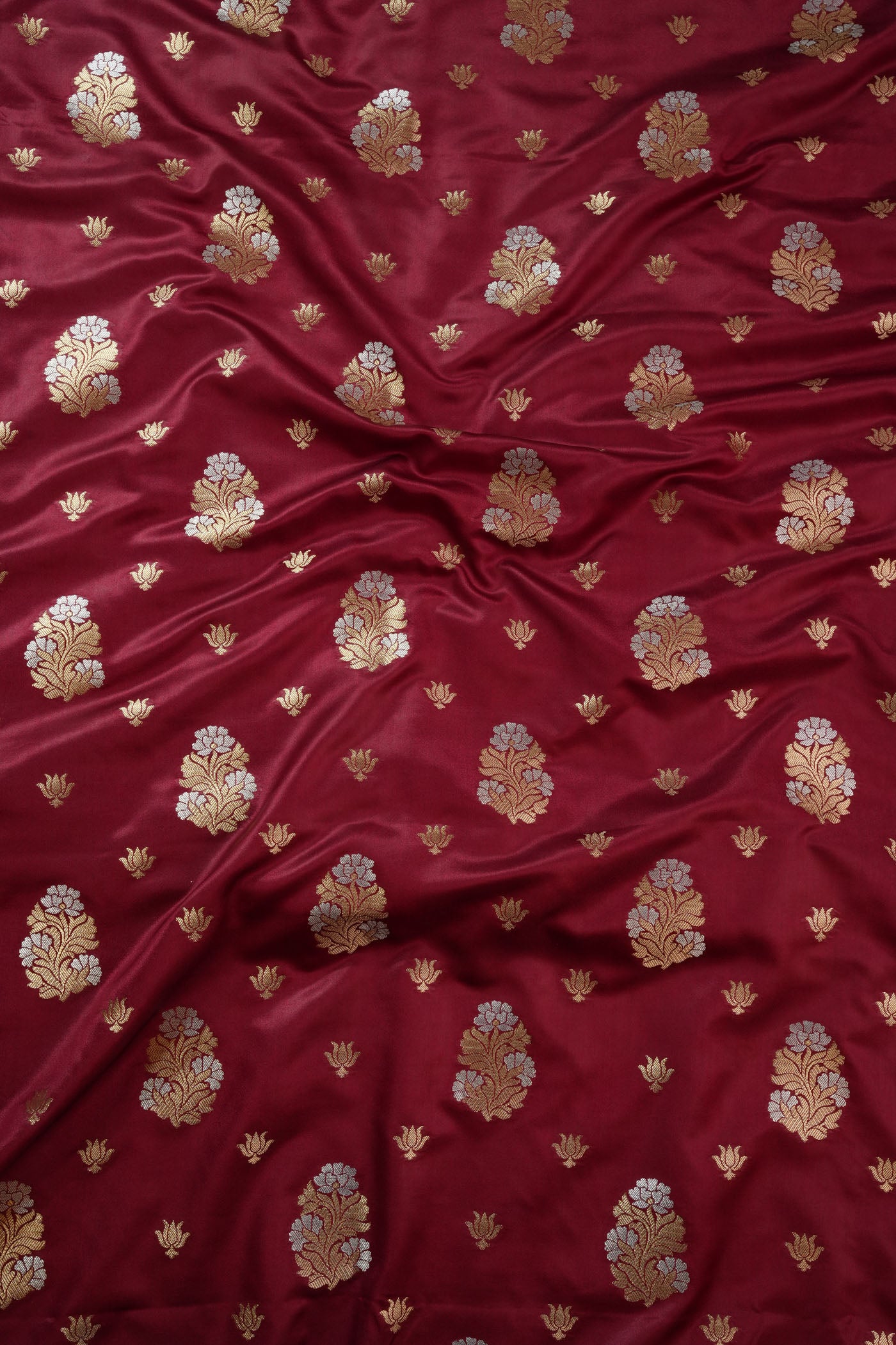 Maroon Fabric with Golden Zari Floral Buta