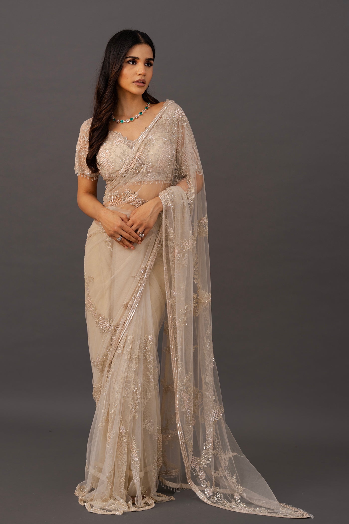 Ivory net saree with ready made blouse
