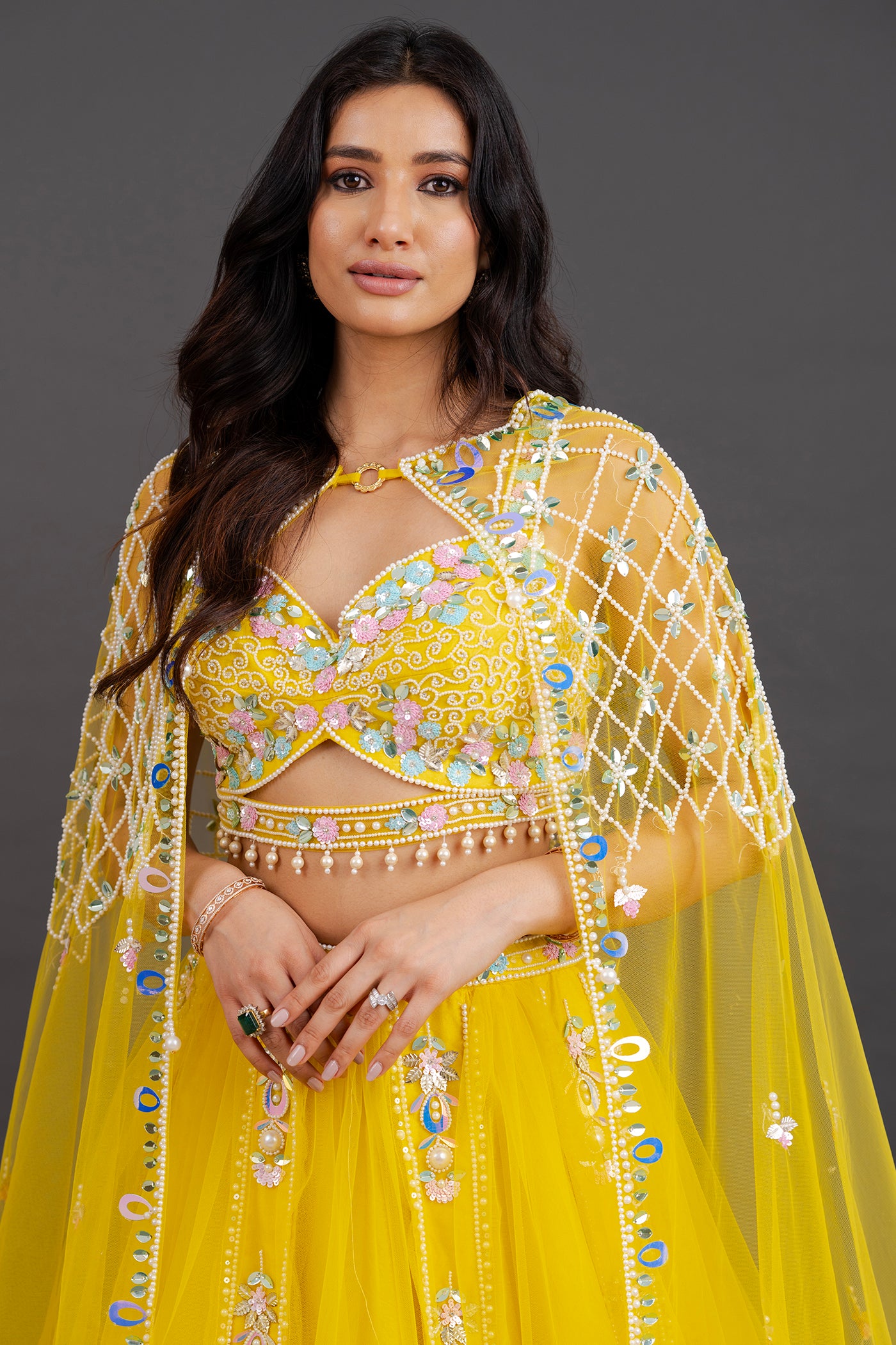 Vibrant yellow net lehenga with floor length cape (RTS)