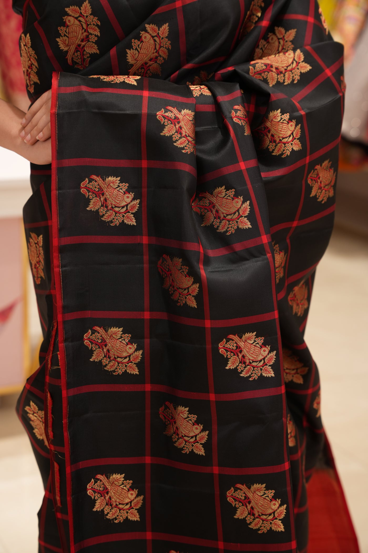 Black & Red Checked Silk Saree that comes along with a contrast pallu